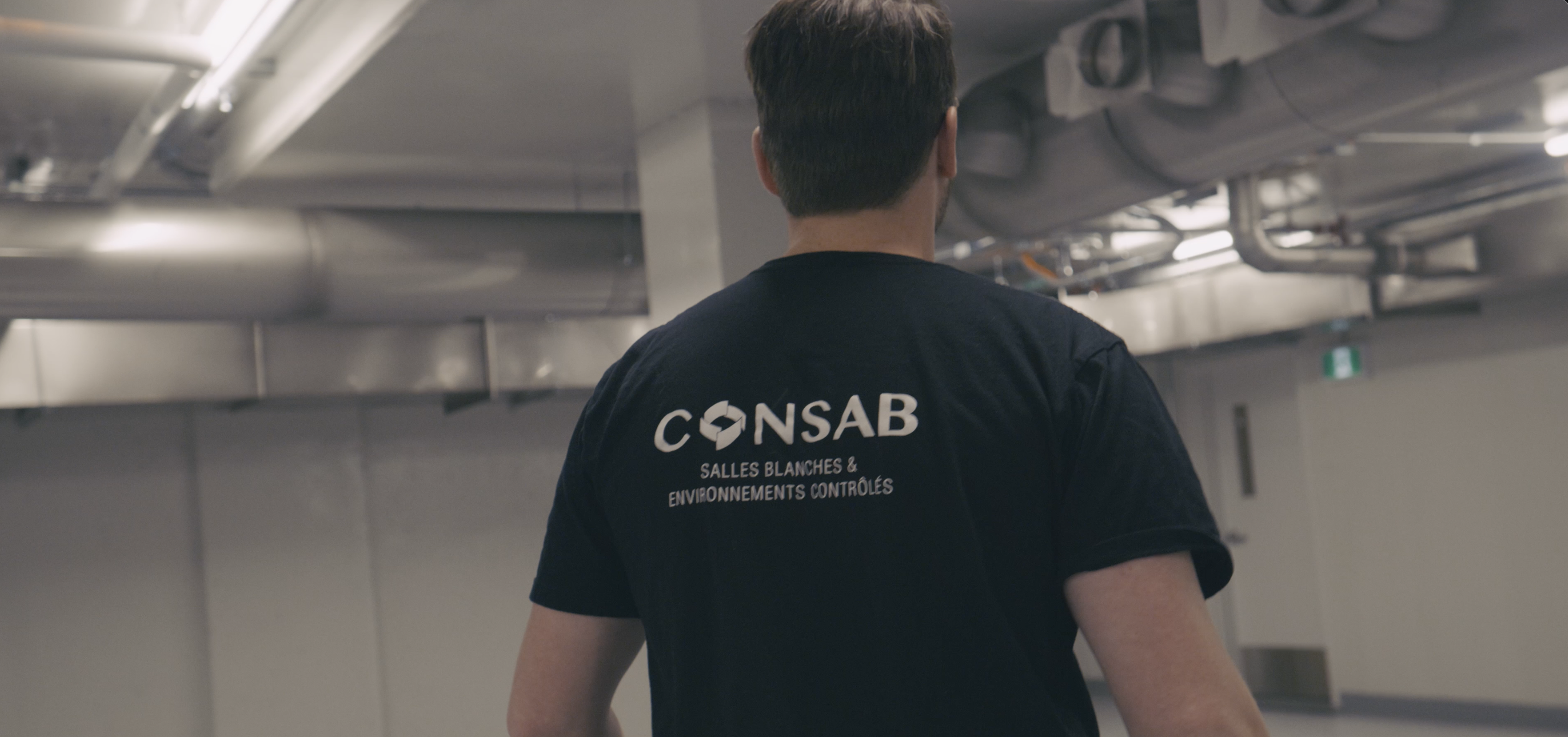 Consab technician inspecting technical installations on the ceiling